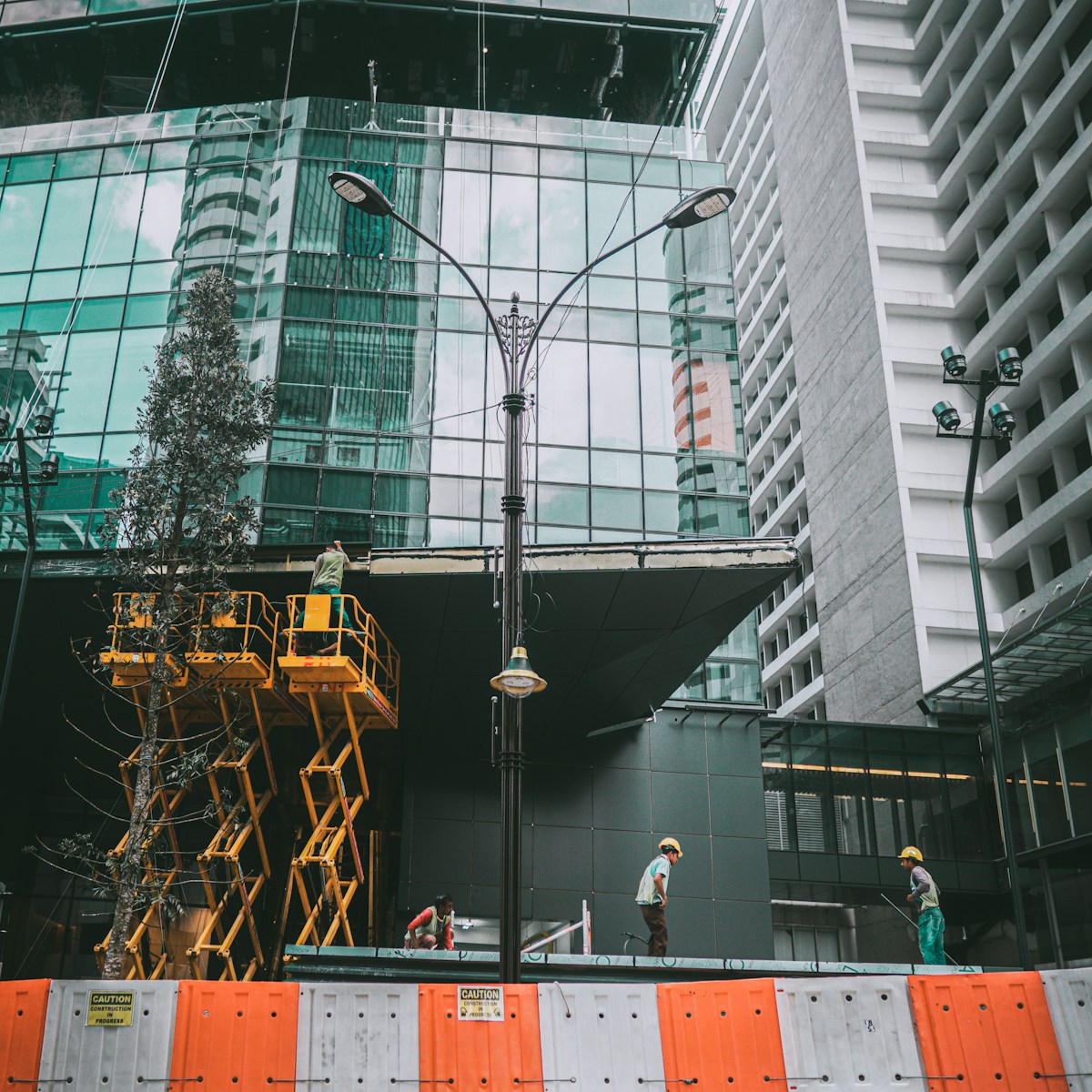 people walking on sidewalk near building during daytime